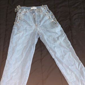 Mom jean with chains on the sides